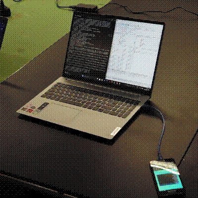 A server phone attached to a laptop.