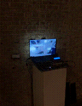 A GIF of myself walking towards the laptop in the exhibition space